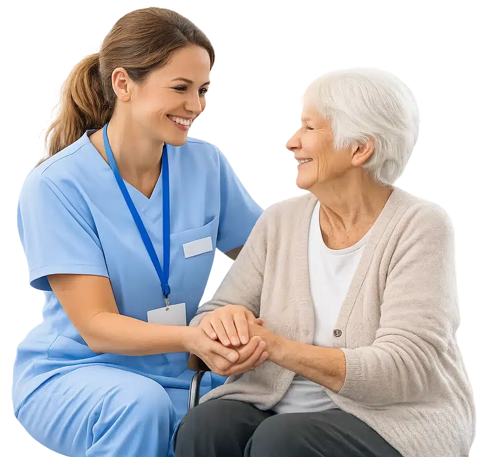 Pflege - Junge Frau in blauer Kleidung mit älterer Dame im Gespräch